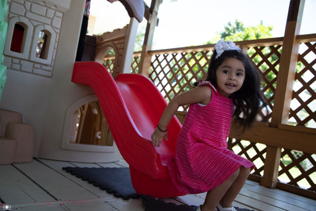 Play2Learn preschooler going down slide